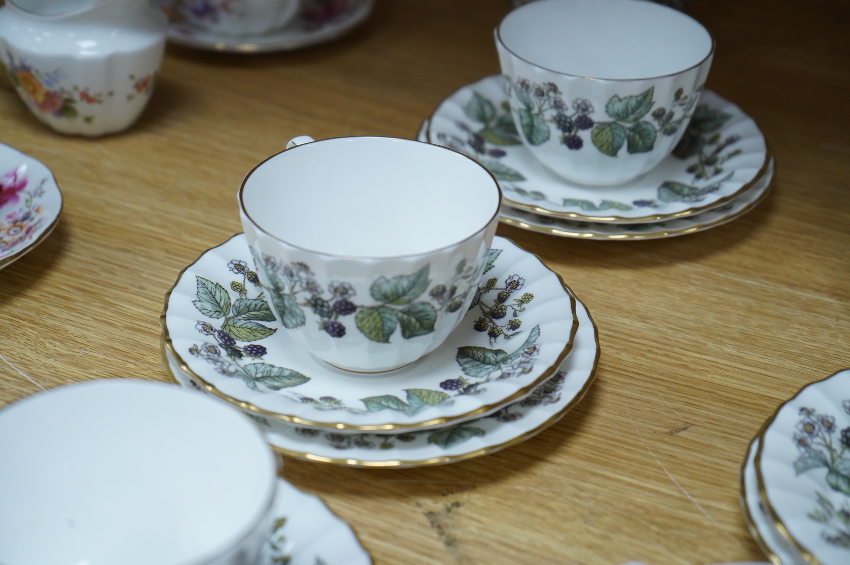 A Royal Crown Derby tea for two set, and a Royal Worcester Lavinia pattern part tea set to include trios, largest 20cm wide